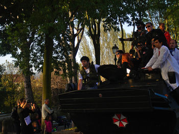 Group of people sitting in front of building