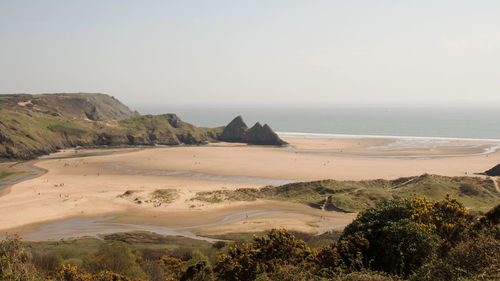 Scenic view of beach against clear sky