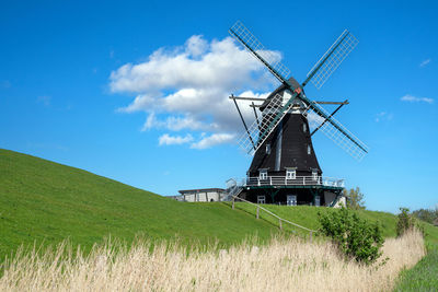 Panoramic image of the windmill of pellworm against blue sky, north frisia, germany