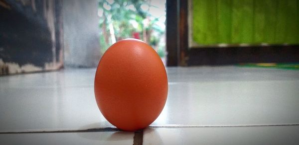 Close-up of red ball on table