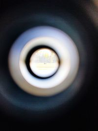 Close-up of camera seen through hole