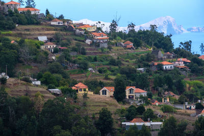 Houses in town against sky