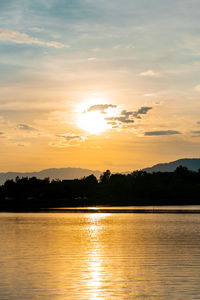 Scenic view of lake against sky during sunset