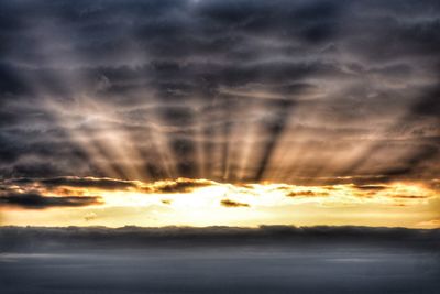 Scenic view of dramatic sky during sunset