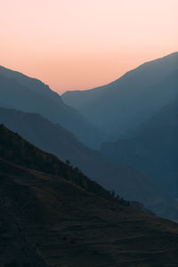 Scenic view of mountains against sky during sunset