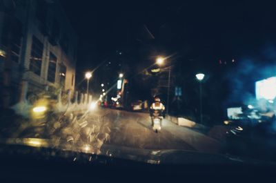 Illuminated street at night