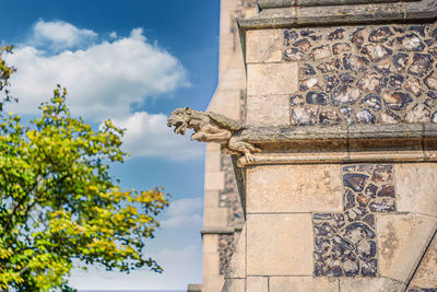 Terrible stone gargoyle at st albans church facade. copenhagen, denmark