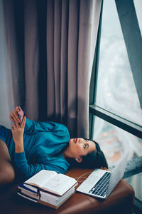 Young woman lying on table