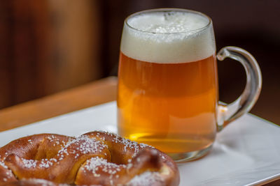 Close-up of beer glass on table