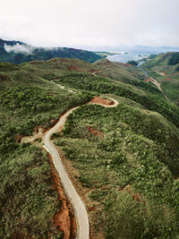 Scenic view of road amidst landscape against sky