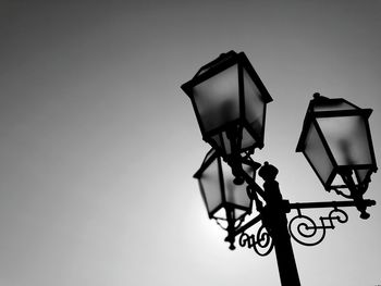 Low angle view of lamp post against sky