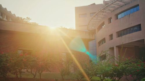 Sun shining through building