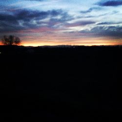 Silhouette of landscape against dramatic sky