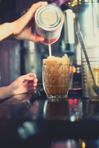 Close-up of hand holding coffee cup