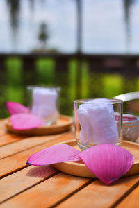 Close-up of pink rose on table