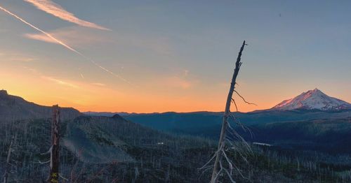 Scenic view of mountains against sky during sunset