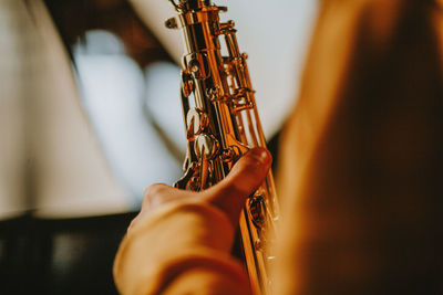 Close-up of hand playing guitar