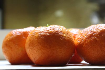 Close-up of oranges on table