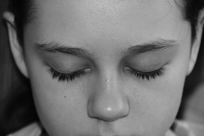 Close-up of girl with eyes closed