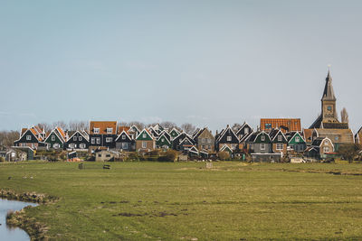 Built structure on field against sky