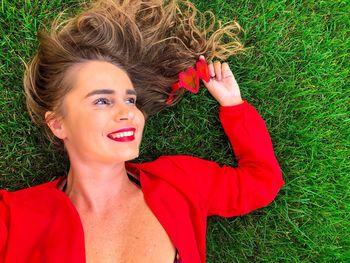 Portrait of young woman on field