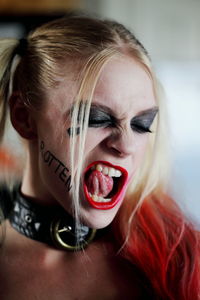 Close-up of young woman making a face during halloween cosplay