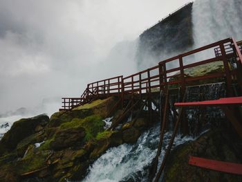 Bridge over lake against mountain