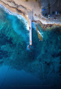 High angle view of swimming pool by sea