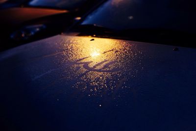 Close-up of car on road