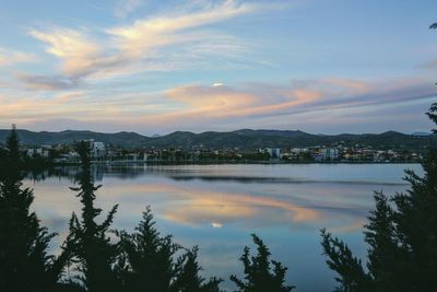 Scenic view of lake against sky during sunset