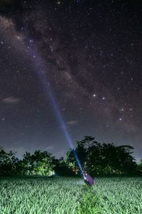 Scenic view of field against sky at night