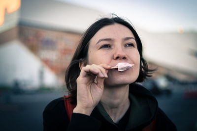 Close-up of mid adult woman eating ice cream