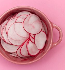 High angle view of pink balls on white background