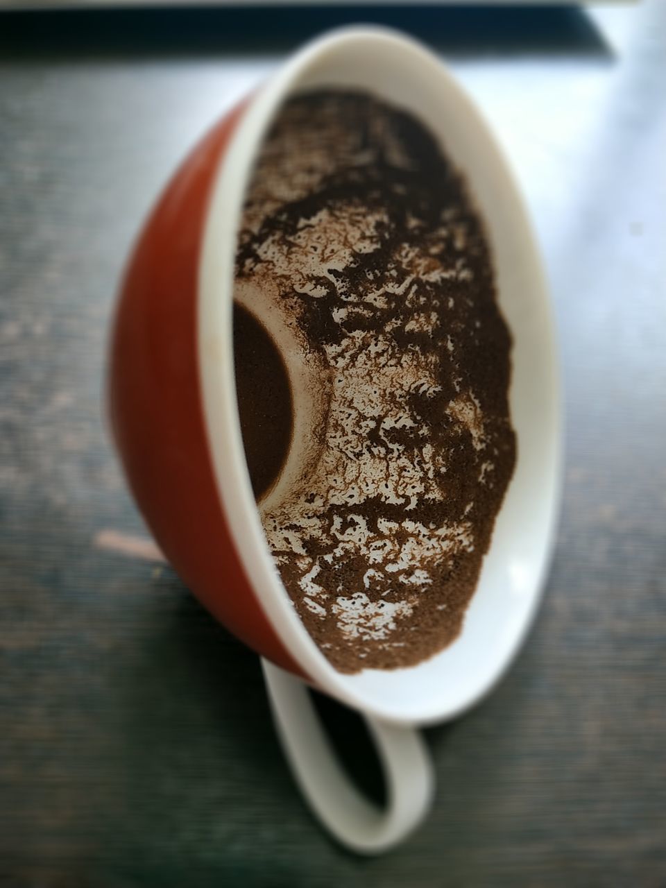 DIRECTLY ABOVE SHOT OF COFFEE CUP WITH SPOON ON TABLE