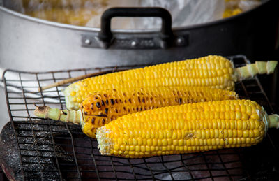 Close-up of yellow meat on barbecue grill
