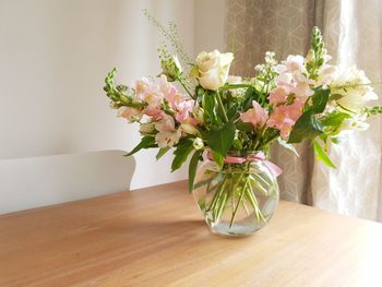 Flower vase on table at home