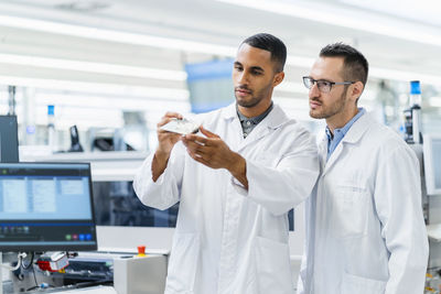 Portrait of female doctor standing in laboratory