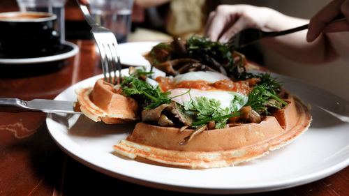 Close-up of hand served in plate on table