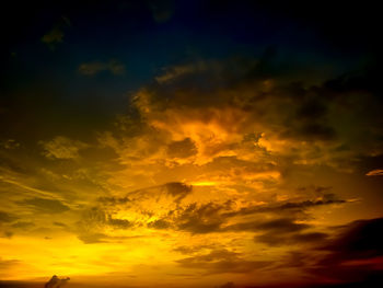 Low angle view of dramatic sky during sunset