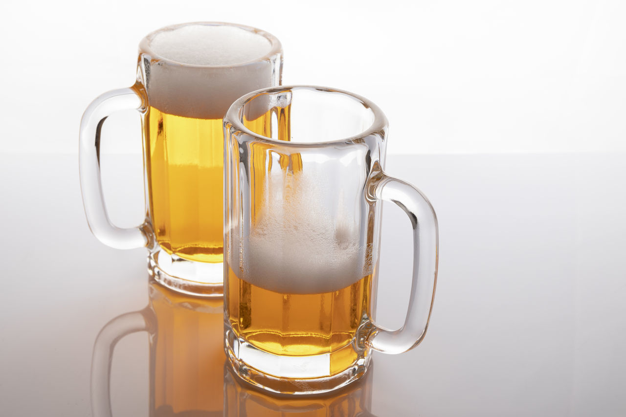 CLOSE-UP OF BEER GLASS WITH SPOON