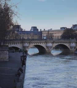 Bridge over river with buildings in background