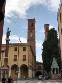 Buildings in city against sky