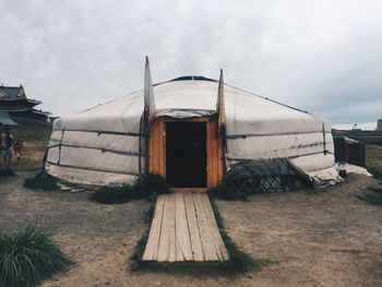 Tent on field against sky