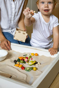 High angle view of friends standing on table