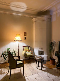 Empty chairs and tables against wall at home