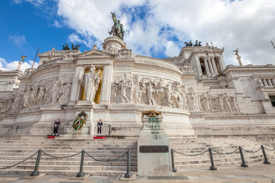 Low angle view of historical building against cloudy sky