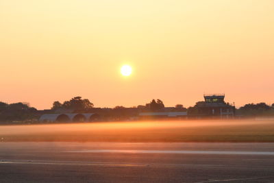 Built structure against clear sky during sunset