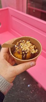 Close-up of hand holding ice cream