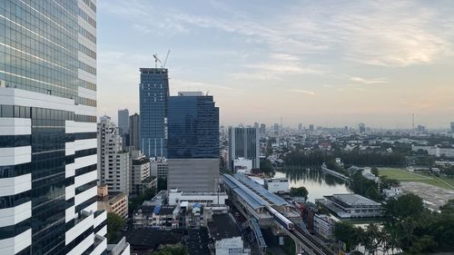 High angle view of buildings in city against sky