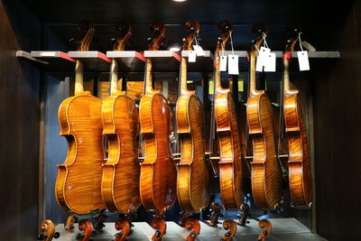 Violins hanging for sale in store